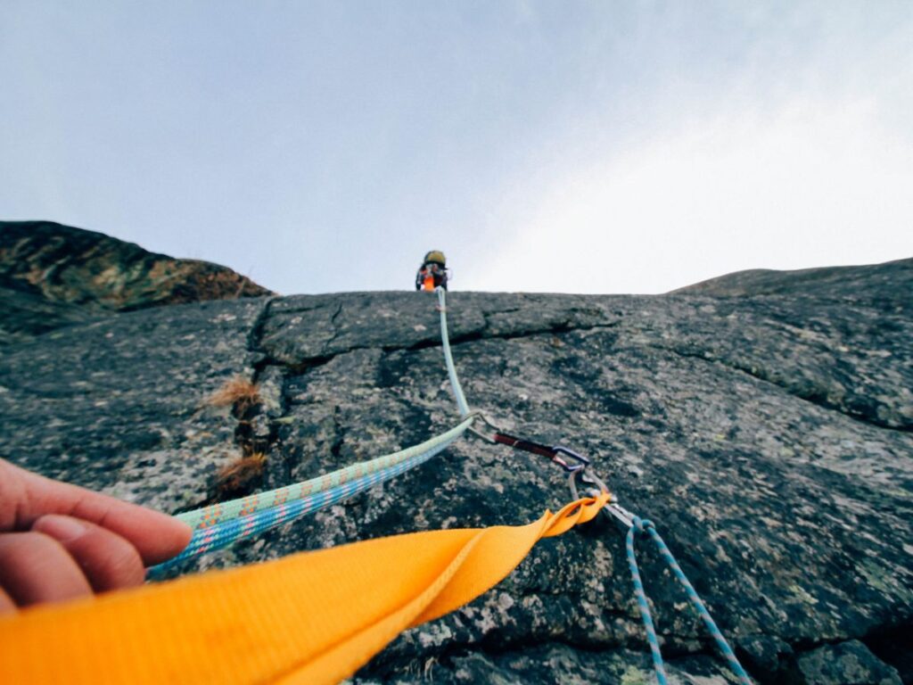 Climbing gears with a man climbing El Capitan