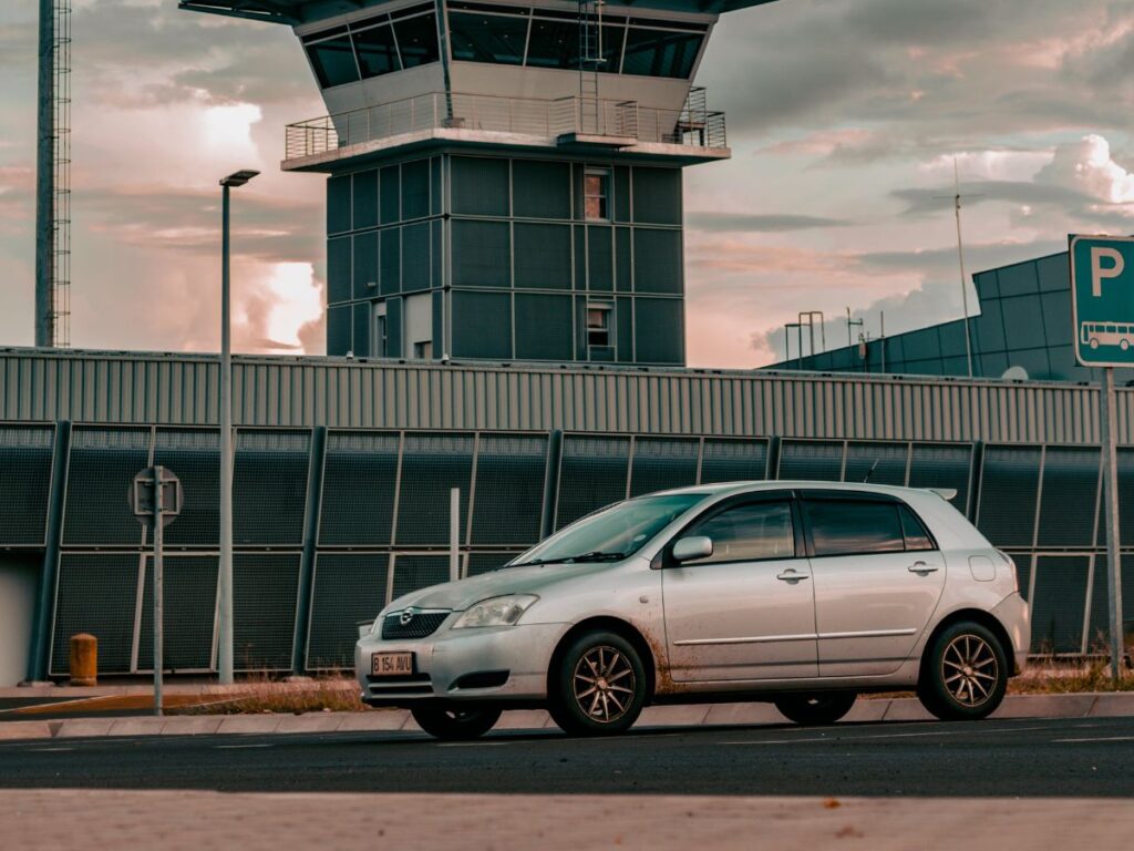 car in front of airport