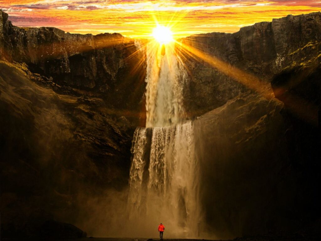 waterfall with sun shining