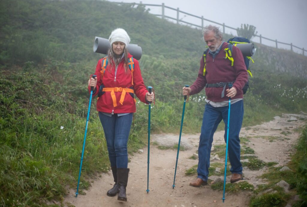 elderly and an adult on a trail